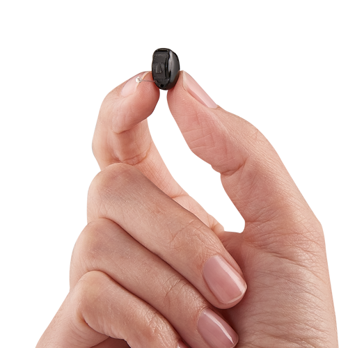 Invisible-In-Canal hearing aid in hand
